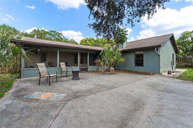 3220 Cardigan Ct, Orlando, FL 32812 - rear view of property with stucco siding, a patio, and a sunroom