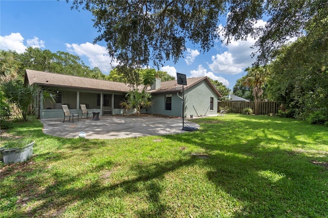 3220 Cardigan Ct, Orlando, FL 32812 - rear view of house featuring a chimney, a patio area, stucco siding, and a sunroom