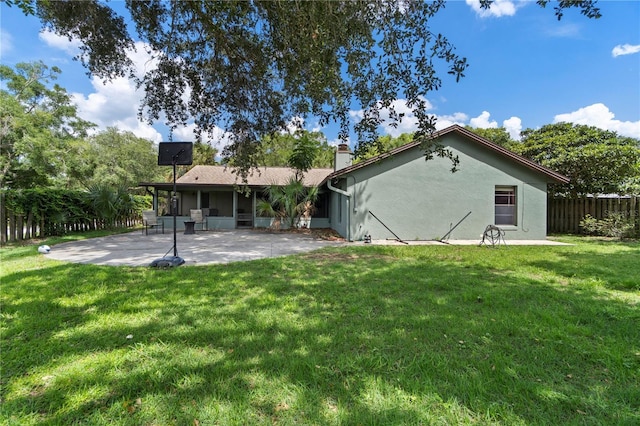 3220 Cardigan Ct, Orlando, FL 32812 - back of property with a patio, a chimney, a sunroom, and stucco siding