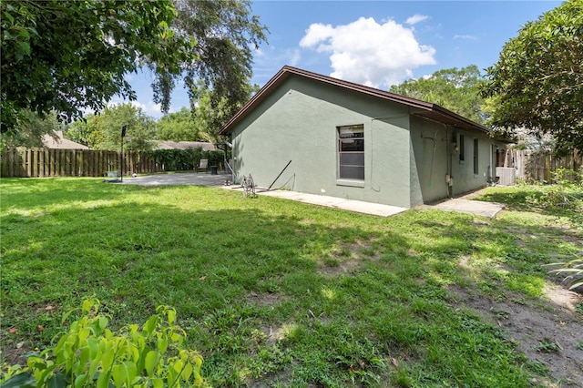 3220 Cardigan Ct, Orlando, FL 32812 - view of home's exterior featuring stucco siding, a patio, and a fenced backyard