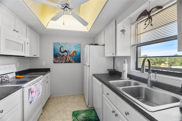 9860 62nd Ter N Unit 1047, Saint Petersburg, FL 33708 - kitchen with white appliances, ceiling fan, white cabinetry, dark countertops, and light tile patterned floors