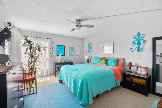 9860 62nd Ter N Unit 1047, Saint Petersburg, FL 33708 - bedroom featuring carpet, a textured ceiling, and a ceiling fan