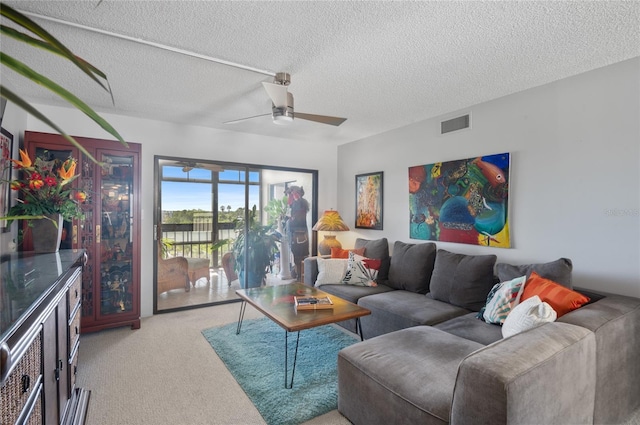 9860 62nd Ter N Unit 1047, Saint Petersburg, FL 33708 - living area featuring light carpet, ceiling fan, and a textured ceiling