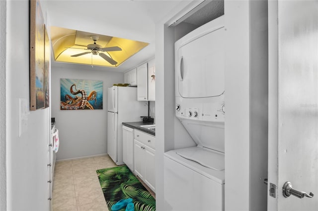 9860 62nd Ter N Unit 1047, Saint Petersburg, FL 33708 - laundry room with stacked washer / drying machine and a ceiling fan