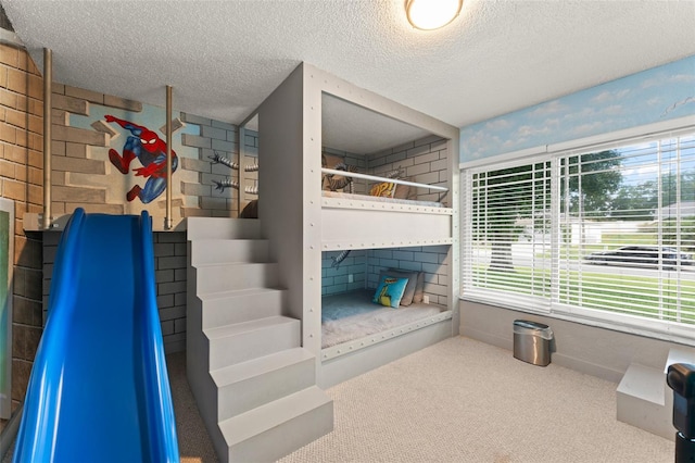 7764 Indian Ridge Trl N, Kissimmee, FL 34747 - living area featuring carpet flooring and a textured ceiling