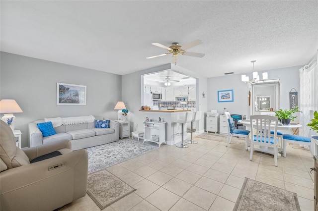 11923 Boynton Ln Unit B, New Port Richey, FL 34654 - living area featuring a ceiling fan, light tile patterned floors, and a chandelier