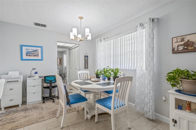 11923 Boynton Ln Unit B, New Port Richey, FL 34654 - dining area featuring a chandelier, a textured ceiling, light tile patterned floors, and an office area