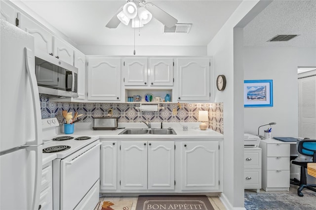 11923 Boynton Ln Unit B, New Port Richey, FL 34654 - kitchen featuring white appliances, ceiling fan, backsplash, light countertops, and white cabinets