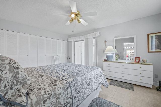 11923 Boynton Ln Unit B, New Port Richey, FL 34654 - bedroom featuring a textured ceiling, light tile patterned floors, and a ceiling fan