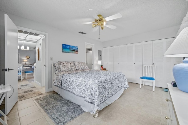 11923 Boynton Ln Unit B, New Port Richey, FL 34654 - bedroom with light tile patterned floors, a textured ceiling, a ceiling fan, and electric panel