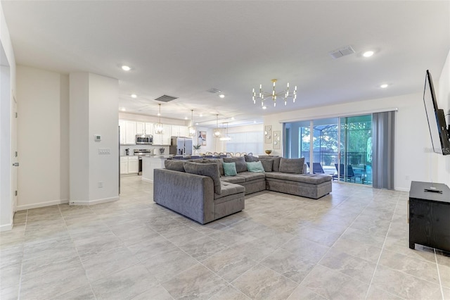 2537 Shanti Dr, Kissimmee, FL 34746 - living room featuring recessed lighting, a chandelier, and light tile patterned floors