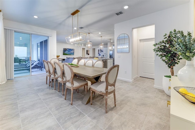 2537 Shanti Dr, Kissimmee, FL 34746 - dining room with a chandelier, recessed lighting, plenty of natural light, and light tile patterned flooring