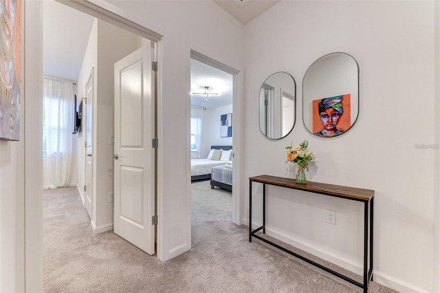 2537 Shanti Dr, Kissimmee, FL 34746 - hallway with light carpet and baseboards