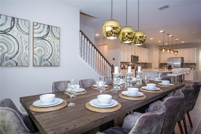 9071 Sunshine Ridge Loop, Kissimmee, FL 34747 - dining room featuring stairs and recessed lighting