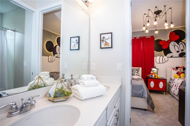 9071 Sunshine Ridge Loop, Kissimmee, FL 34747 - bathroom with double vanity, ensuite bath, and a shower with shower curtain