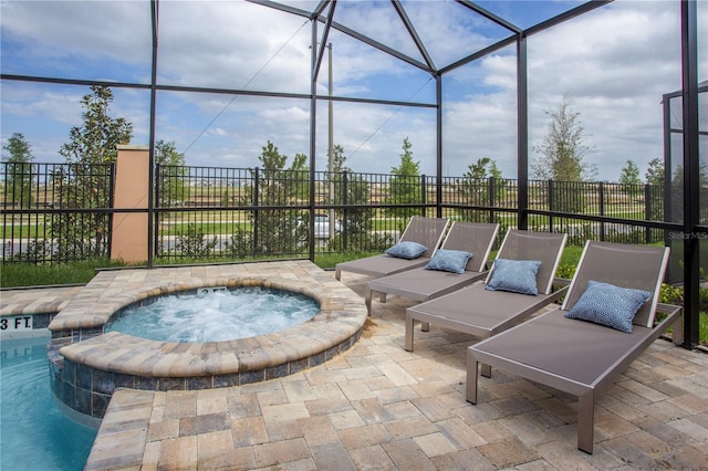 9071 Sunshine Ridge Loop, Kissimmee, FL 34747 - view of patio / terrace with an in-ground hot tub and glass enclosure