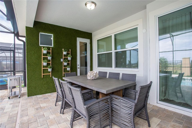 9071 Sunshine Ridge Loop, Kissimmee, FL 34747 - view of patio / terrace featuring glass enclosure