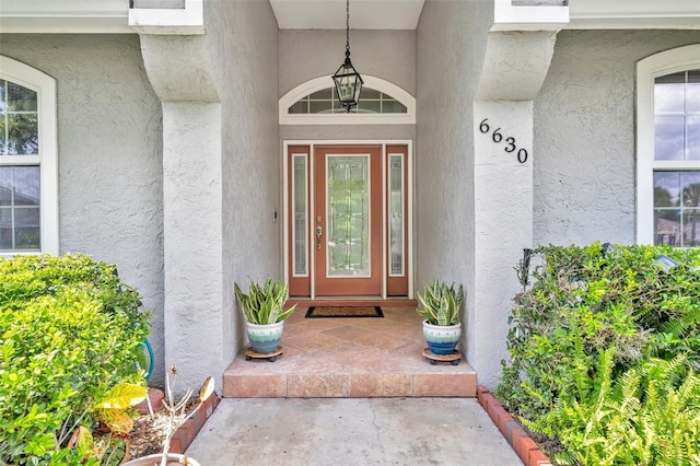 6630 Hidden Beach Cir, Orlando, FL 32819 - view of exterior entry with stucco siding