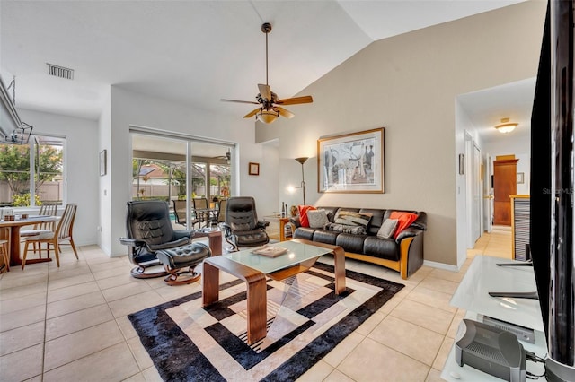 6630 Hidden Beach Cir, Orlando, FL 32819 - living area with light tile patterned floors, vaulted ceiling, and ceiling fan