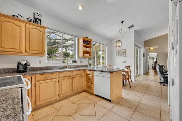 6630 Hidden Beach Cir, Orlando, FL 32819 - kitchen featuring white appliances, lofted ceiling, a peninsula, light tile patterned flooring, and decorative light fixtures