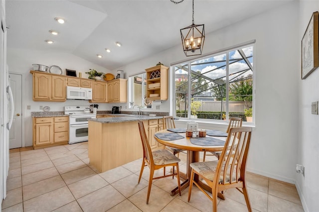 6630 Hidden Beach Cir, Orlando, FL 32819 - kitchen featuring white appliances, light brown cabinetry, a peninsula, light tile patterned floors, and a chandelier