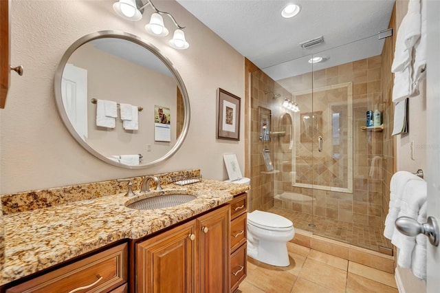 6630 Hidden Beach Cir, Orlando, FL 32819 - bathroom featuring vanity, a shower stall, tile patterned floors, and recessed lighting