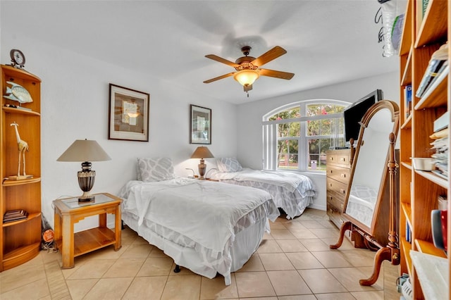 6630 Hidden Beach Cir, Orlando, FL 32819 - bedroom with light tile patterned flooring and a ceiling fan