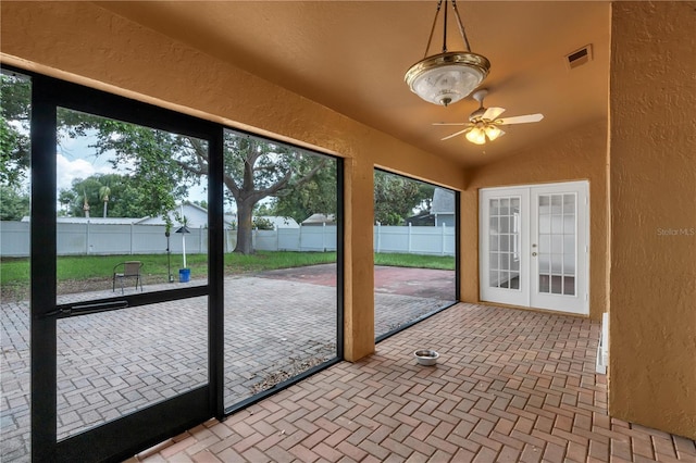 12713 Pine Arbor Dr, Clermont, FL 34711 - unfurnished sunroom featuring french doors, plenty of natural light, ceiling fan, and lofted ceiling