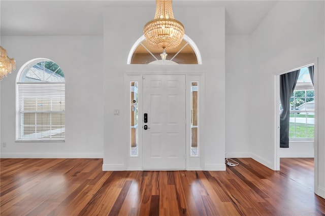 12713 Pine Arbor Dr, Clermont, FL 34711 - foyer with a chandelier, healthy amount of natural light, and wood finished floors