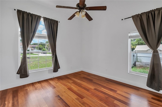 12713 Pine Arbor Dr, Clermont, FL 34711 - spare room featuring wood finished floors, healthy amount of natural light, and ceiling fan