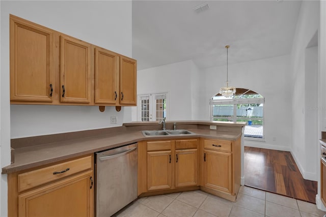 12713 Pine Arbor Dr, Clermont, FL 34711 - kitchen featuring dishwasher, a peninsula, light tile patterned floors, and decorative light fixtures