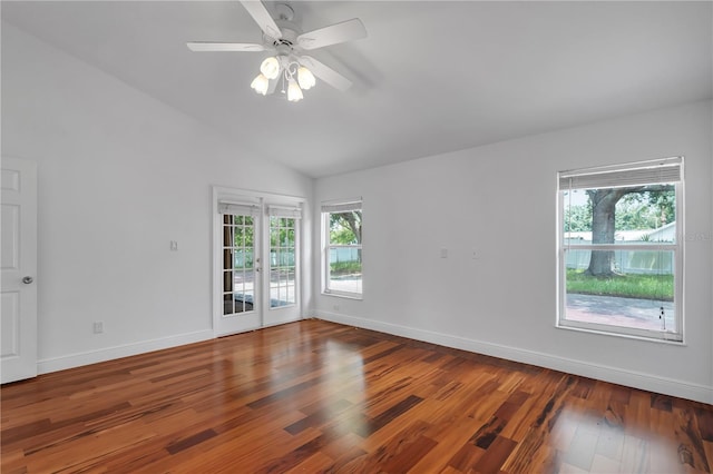 12713 Pine Arbor Dr, Clermont, FL 34711 - empty room with lofted ceiling, wood finished floors, a ceiling fan, and french doors