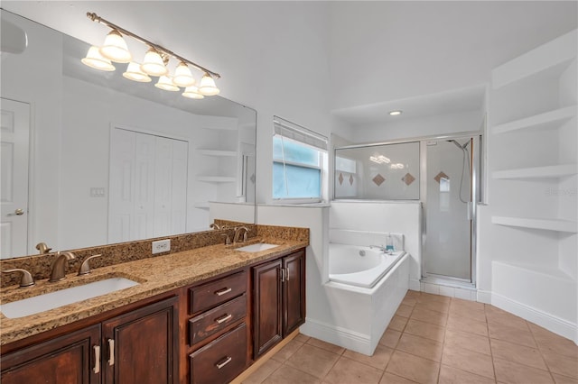 12713 Pine Arbor Dr, Clermont, FL 34711 - full bathroom featuring a garden tub, a shower stall, double vanity, and tile patterned flooring