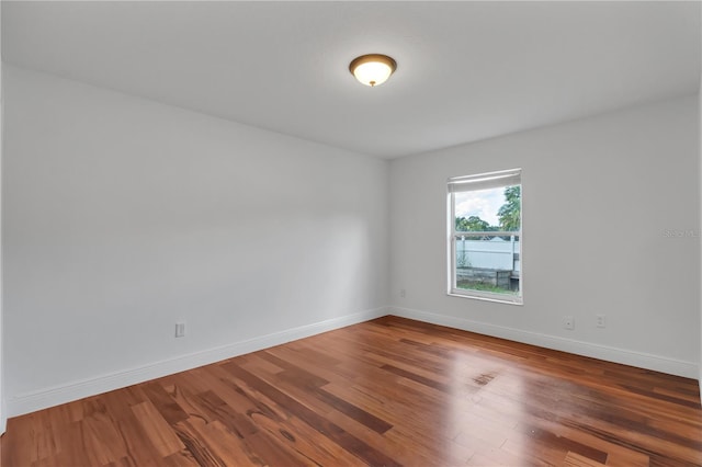 12713 Pine Arbor Dr, Clermont, FL 34711 - spare room featuring wood finished floors