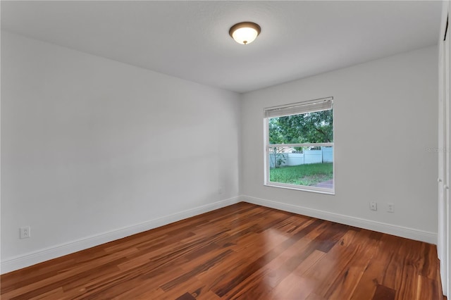 12713 Pine Arbor Dr, Clermont, FL 34711 - unfurnished room featuring dark wood-type flooring and baseboards