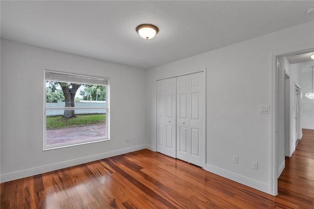 12713 Pine Arbor Dr, Clermont, FL 34711 - unfurnished bedroom featuring wood finished floors and a closet