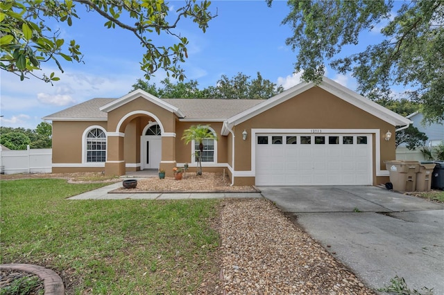 12713 Pine Arbor Dr, Clermont, FL 34711 - ranch-style home featuring stucco siding, driveway, and an attached garage