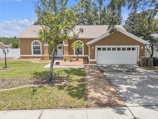 12713 Pine Arbor Dr, Clermont, FL 34711 - ranch-style house with stucco siding, an attached garage, and concrete driveway