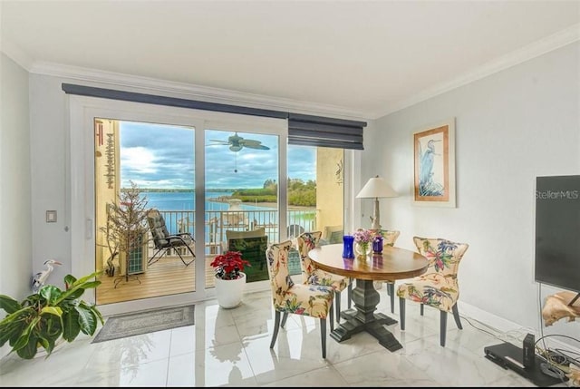 150 Brent Cir, Oldsmar, FL 34677 - dining room with ornamental molding, light marble finish flooring, and a water view