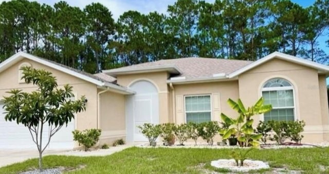 6 Promenade Pl, Palm Coast, FL 32164 - view of front of property featuring a garage, concrete driveway, stucco siding, and a front lawn