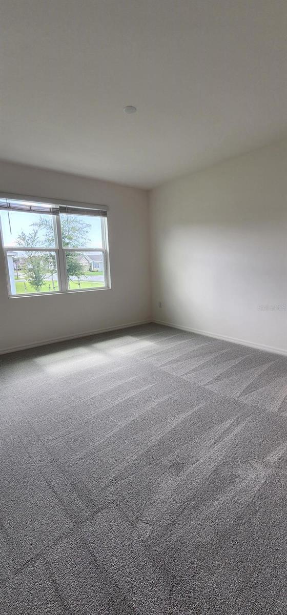 483 Shadow Gorge Way, Eustis, FL 32736 - view of carpeted spare room