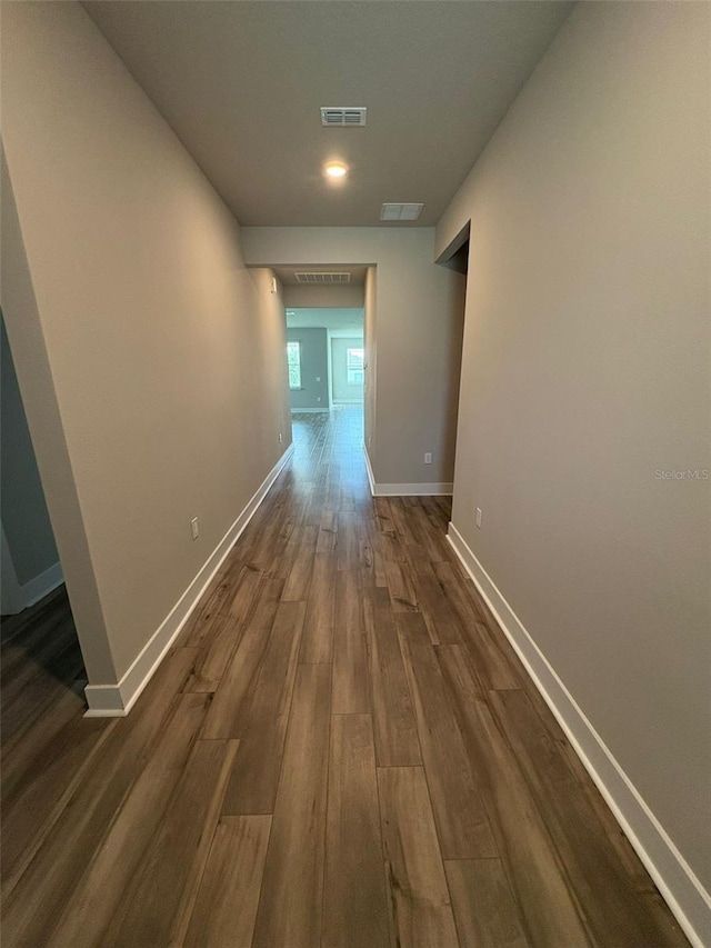 2318 Raven Ridge Rd, Minneola, FL 34715 - hall featuring dark wood finished floors and baseboards