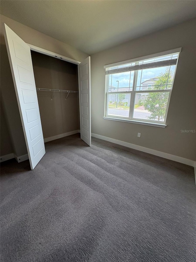2318 Raven Ridge Rd, Minneola, FL 34715 - unfurnished bedroom featuring carpet flooring and a closet