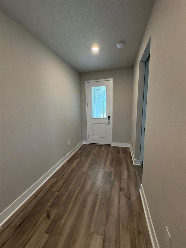 2318 Raven Ridge Rd, Minneola, FL 34715 - entryway featuring dark wood-type flooring and baseboards