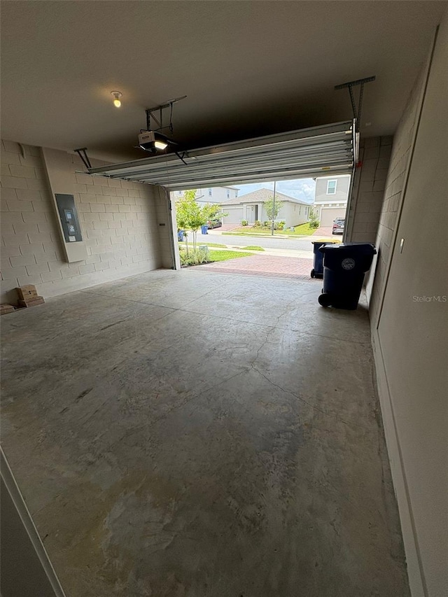 2318 Raven Ridge Rd, Minneola, FL 34715 - garage with a garage door opener and concrete block wall