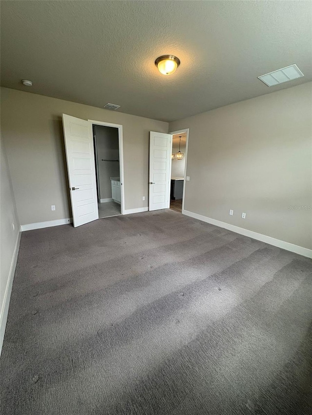 2318 Raven Ridge Rd, Minneola, FL 34715 - unfurnished bedroom featuring carpet and a textured ceiling