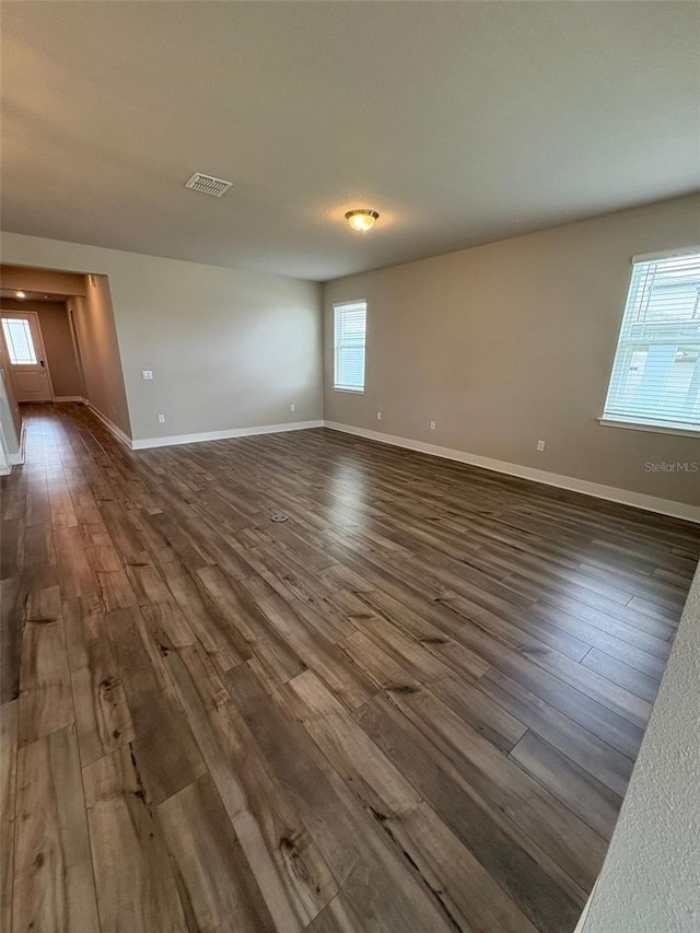2318 Raven Ridge Rd, Minneola, FL 34715 - empty room featuring dark wood-style flooring and baseboards