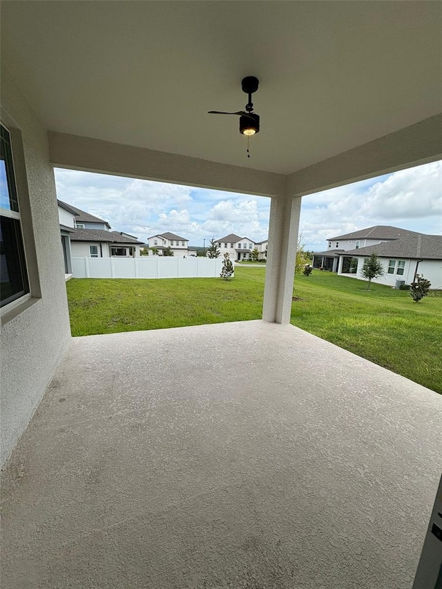 2318 Raven Ridge Rd, Minneola, FL 34715 - view of patio featuring ceiling fan and a residential view