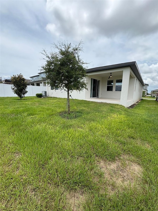 2318 Raven Ridge Rd, Minneola, FL 34715 - back of house featuring stucco siding and a patio area