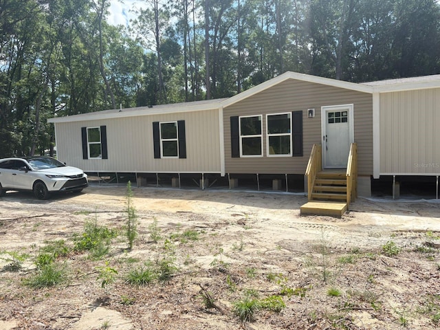 1349NW 109th Ave, Ocala, FL 34482 - manufactured / mobile home featuring entry steps and view of scattered trees